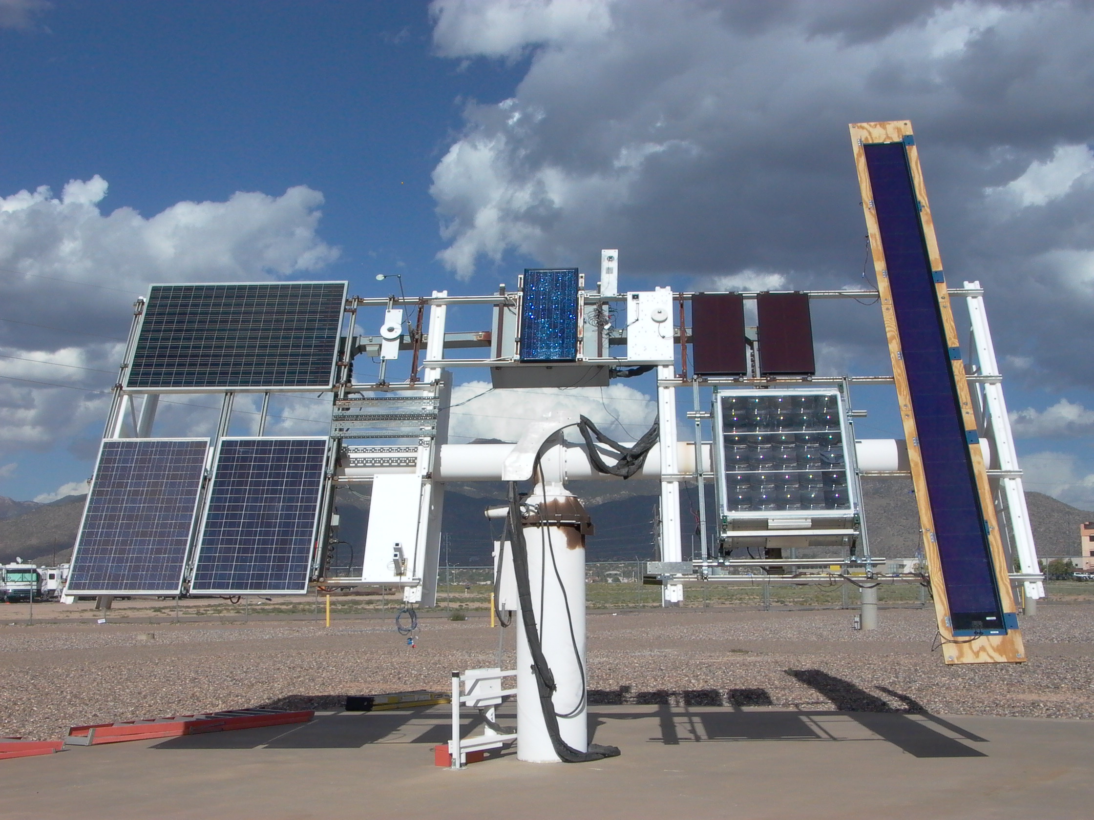 Photo of outdoor testing equipment with a variety of attached PV modules.