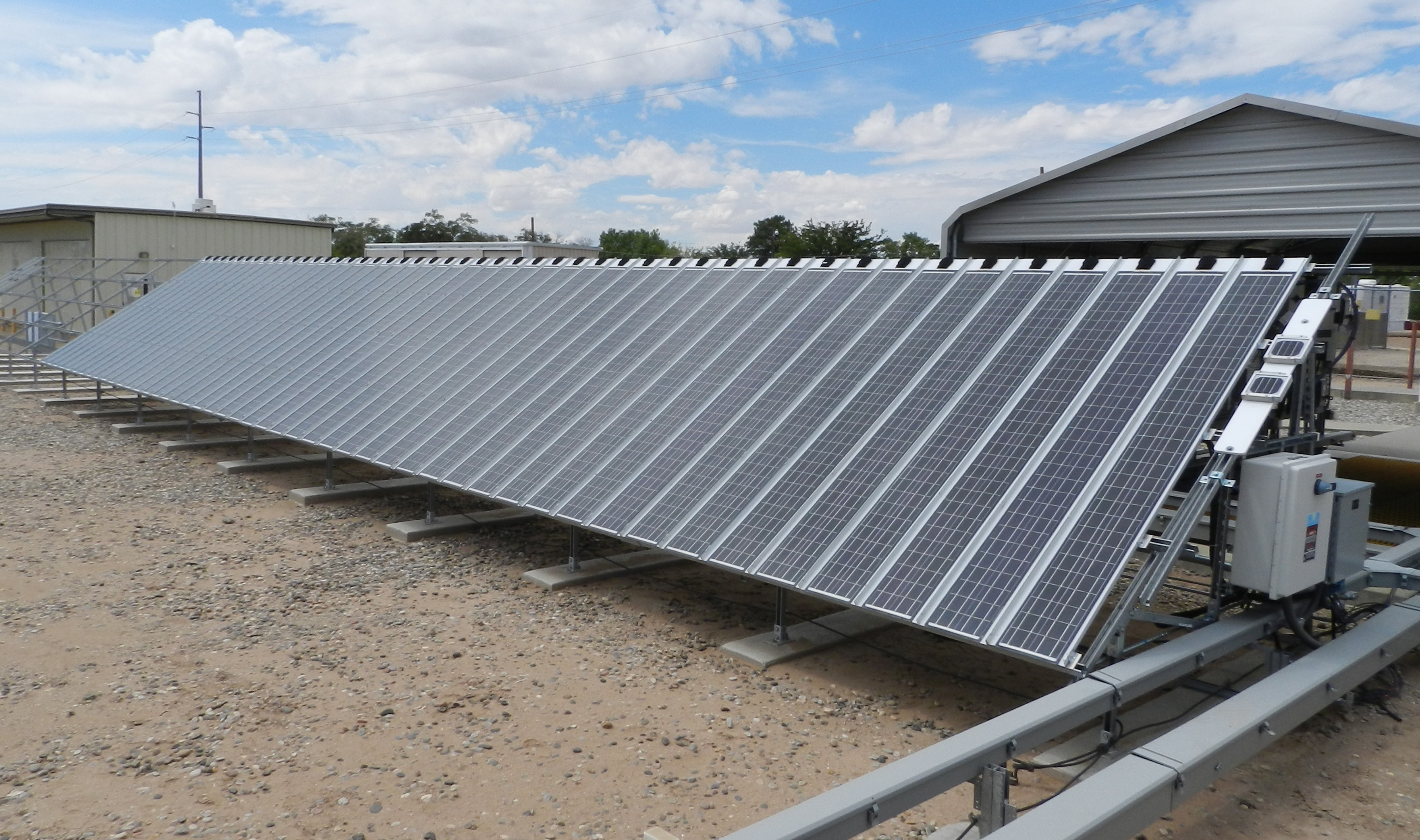 Photo of multiple PV modules attached to make a long array