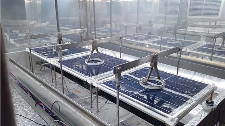 Photo of three PV modules being stress tested