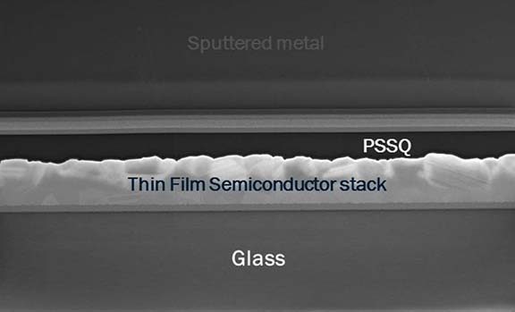 Image showing layers of sputtered metal, PSSQ, thin film semiconductor stack, and glass